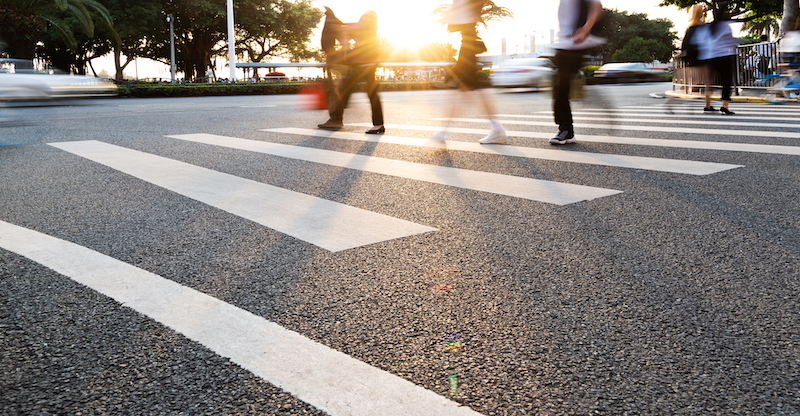 Group of people walking on the crosswalk.