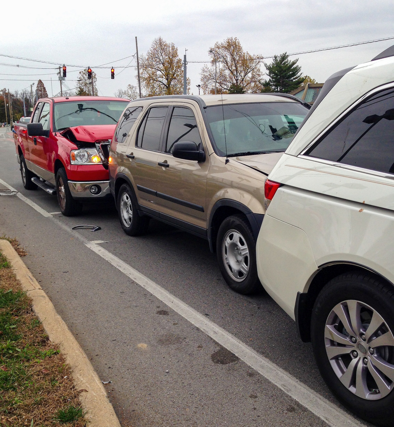 Three-vehicle rear-end accident chain reaction collision.